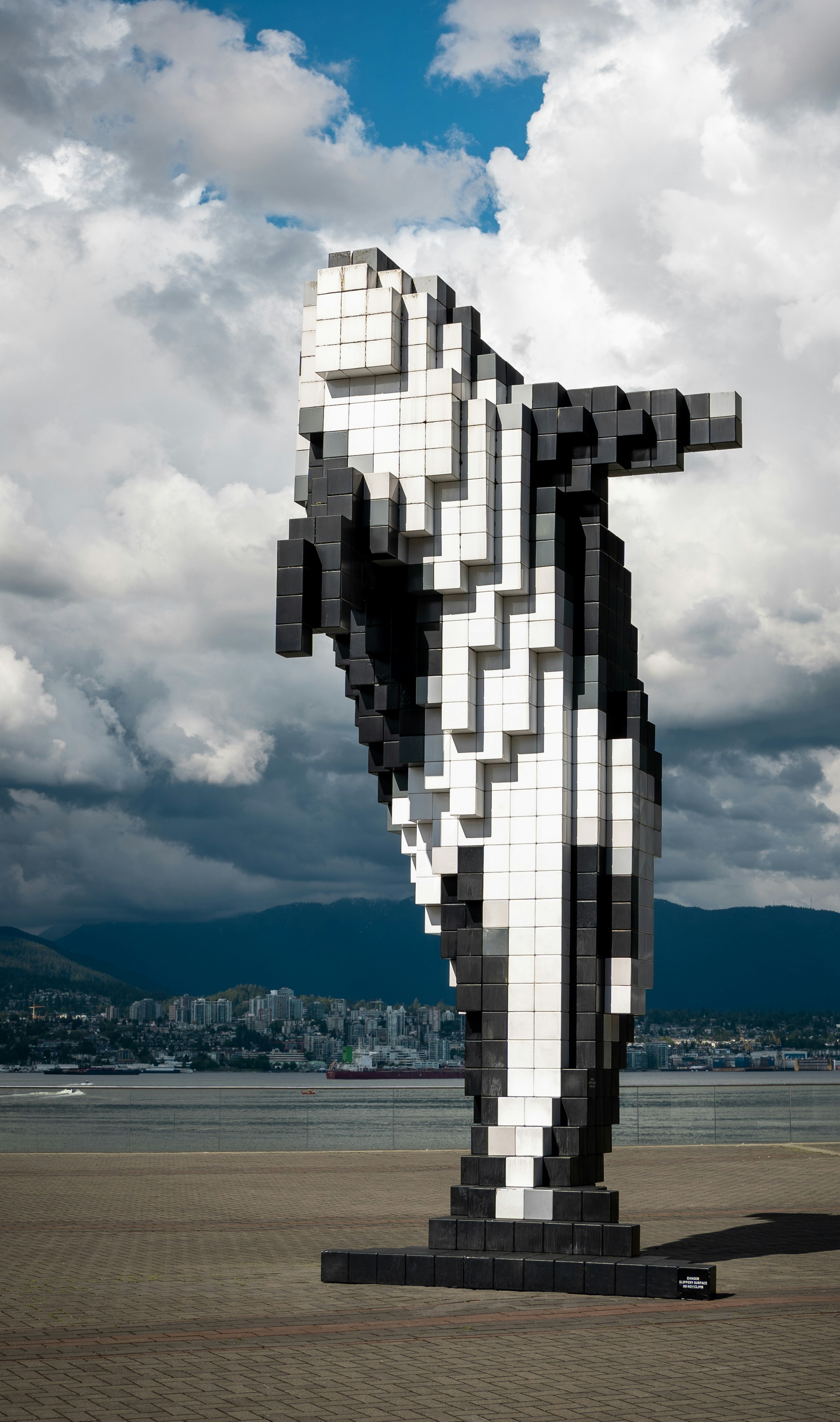Voxel-art orca over the Vancouver skyline